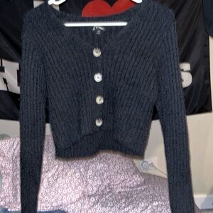 Girls black v neck cropped sweater with buttons.